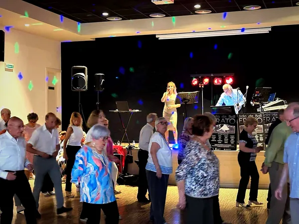 A full dance hall during a performance