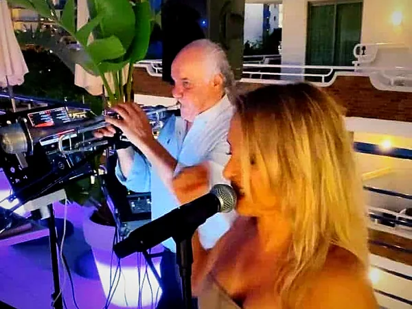 Performance at a hotel pool bar